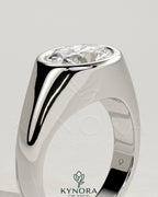 Kynora CJ oval 2ct East-West bezel solitaire engagement ring with signet band, showcasing a sparkling center stone and elegant design.