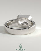 Kynora CJ statement 2-carat radiant east-west bezel solitaire engagement ring with flat cigar band, showcasing sparkling diamond and elegant design.
