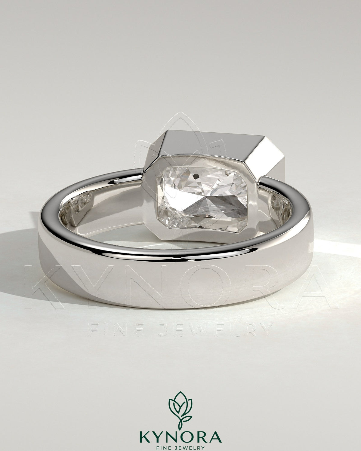 Kynora CJ statement 2-carat radiant east-west bezel solitaire engagement ring with flat cigar band, showcasing sparkling diamond and elegant design.