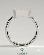 Kynora CJ East-West 2ct radiant diamond bezel solitaire engagement ring with flat cigar band, showcasing elegant jewelry design.