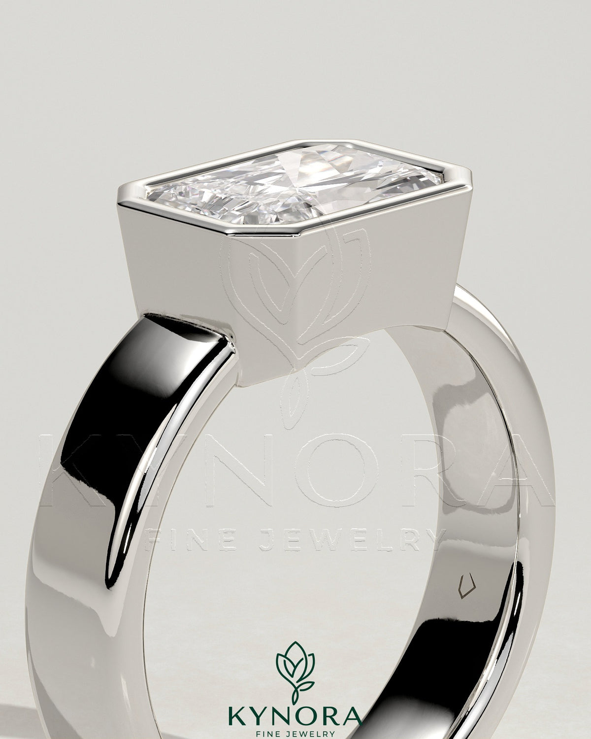 Kynora CJ East-West 2ct radiant diamond bezel solitaire engagement ring with flat cigar band, showcasing elegant design and sparkling stone.