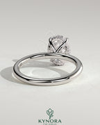 Kynora CJ Classic 2ct oval claw solitaire engagement ring with hidden halo, featuring a sparkling central diamond and elegant band.