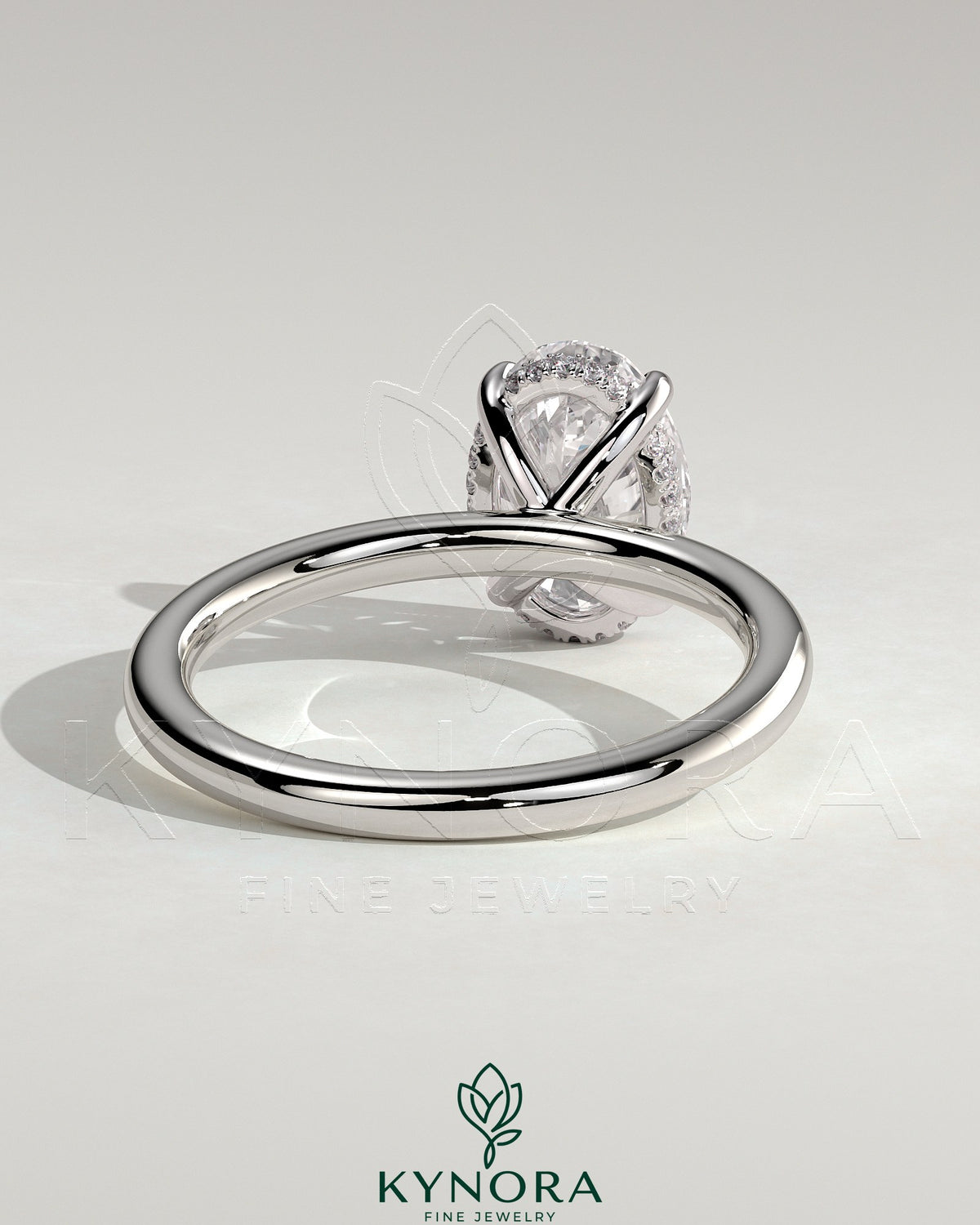 Kynora CJ Classic 2ct oval claw solitaire engagement ring with hidden halo, featuring a sparkling central diamond and elegant band.