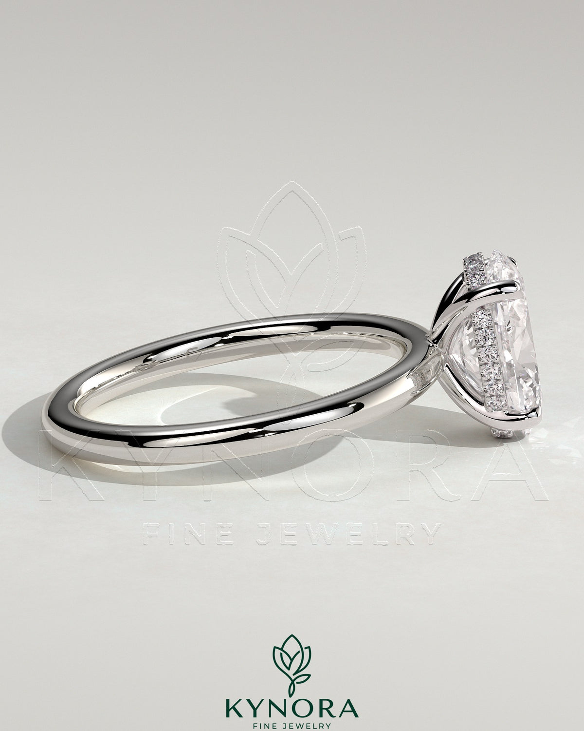 Kynora CJ Classic 2ct oval claw solitaire engagement ring with hidden halo, featuring a sparkling central diamond and elegant band.