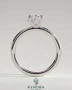 Kynora CJ Classic 2ct oval claw solitaire engagement ring with hidden halo, showcasing a sparkling oval diamond and elegant band.