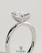 Kynora CJ classic 2ct oval claw solitaire engagement ring with hidden halo, featuring a sparkling central diamond and elegant band