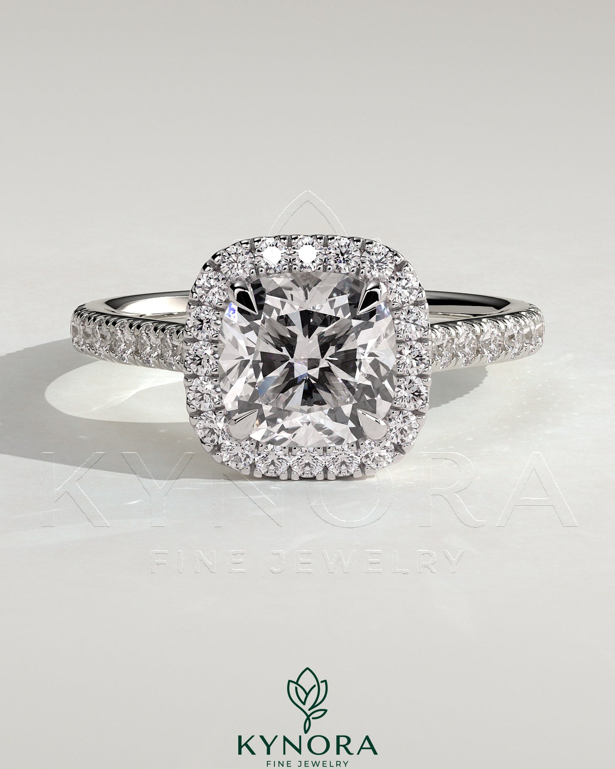 Kynora CJ 2ct cushion cut solitaire halo engagement ring with pave band and cathedral high setting, showcasing intricate detail. Main image