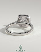 Kynora CJ 2ct cushion claw solitaire engagement ring with halo, pave band, and cathedral high setting in elegant jewelry style