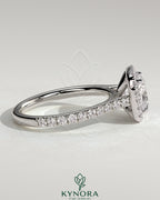 Kynora CJ 2ct cushion claw solitaire engagement ring with halo, pave band, and cathedral high setting, featuring sparkling diamond accents.