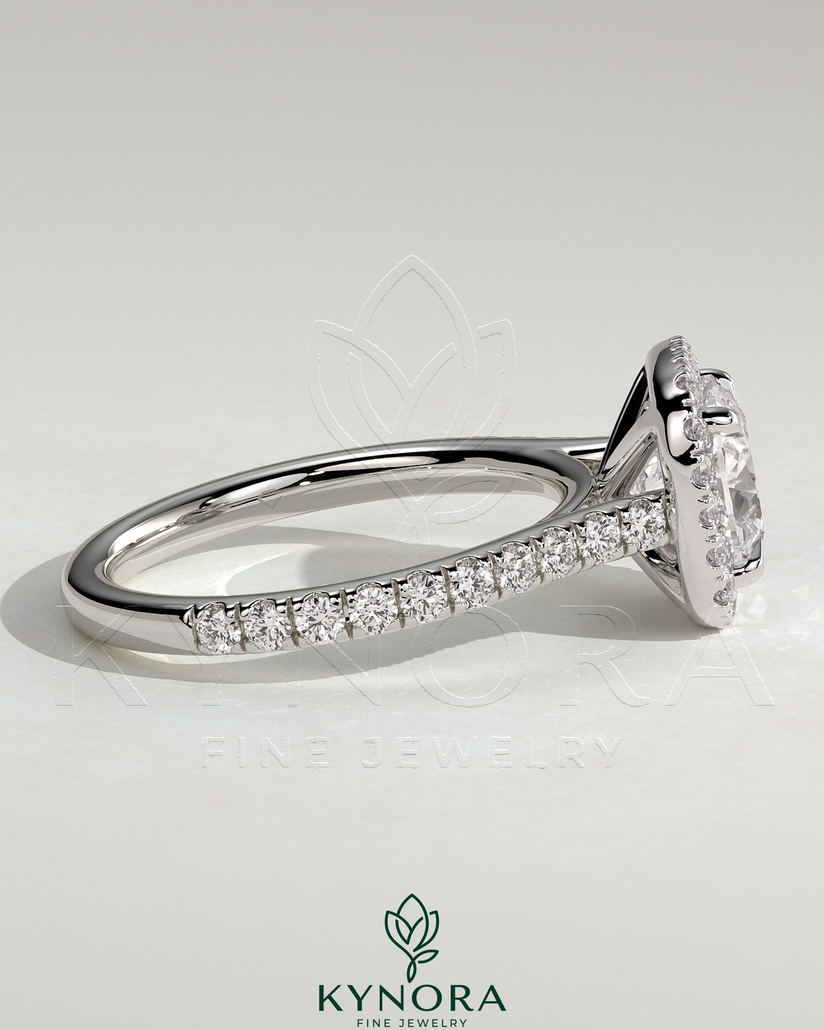 Kynora CJ 2ct cushion claw solitaire engagement ring with halo, pave band, and cathedral high setting, featuring sparkling diamond accents.