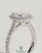 Kynora CJ 2ct cushion claw solitaire engagement ring with halo, pave band, and cathedral high setting in elegant jewelry design