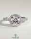 Kynora CJ 2ct cushion cut halo engagement ring with pave band and claw setting, featuring sparkling diamonds.