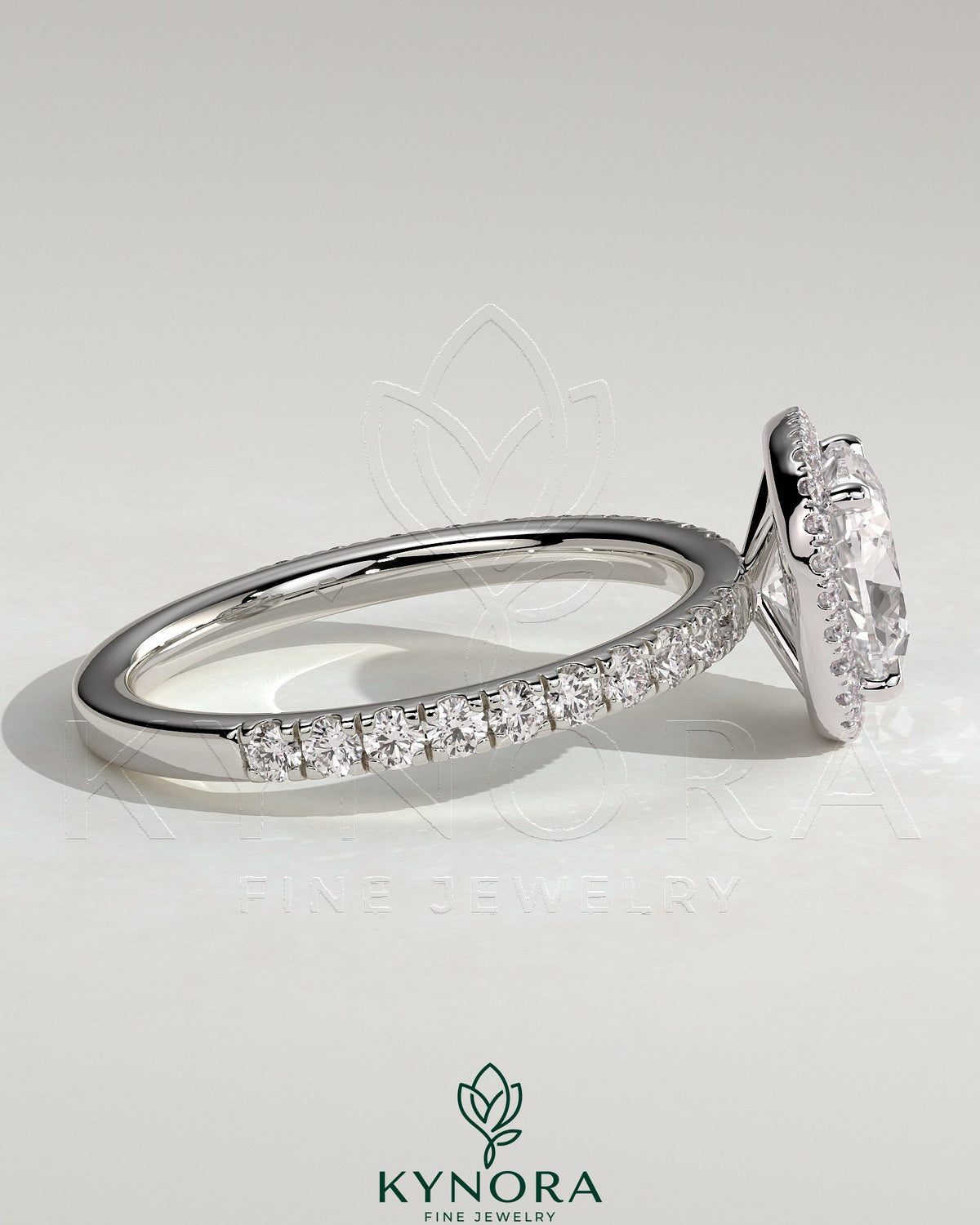 Kynora CJ 2ct cushion cut diamond halo engagement ring with pave band, showcasing elegant jewelry design and sparkling gemstones.