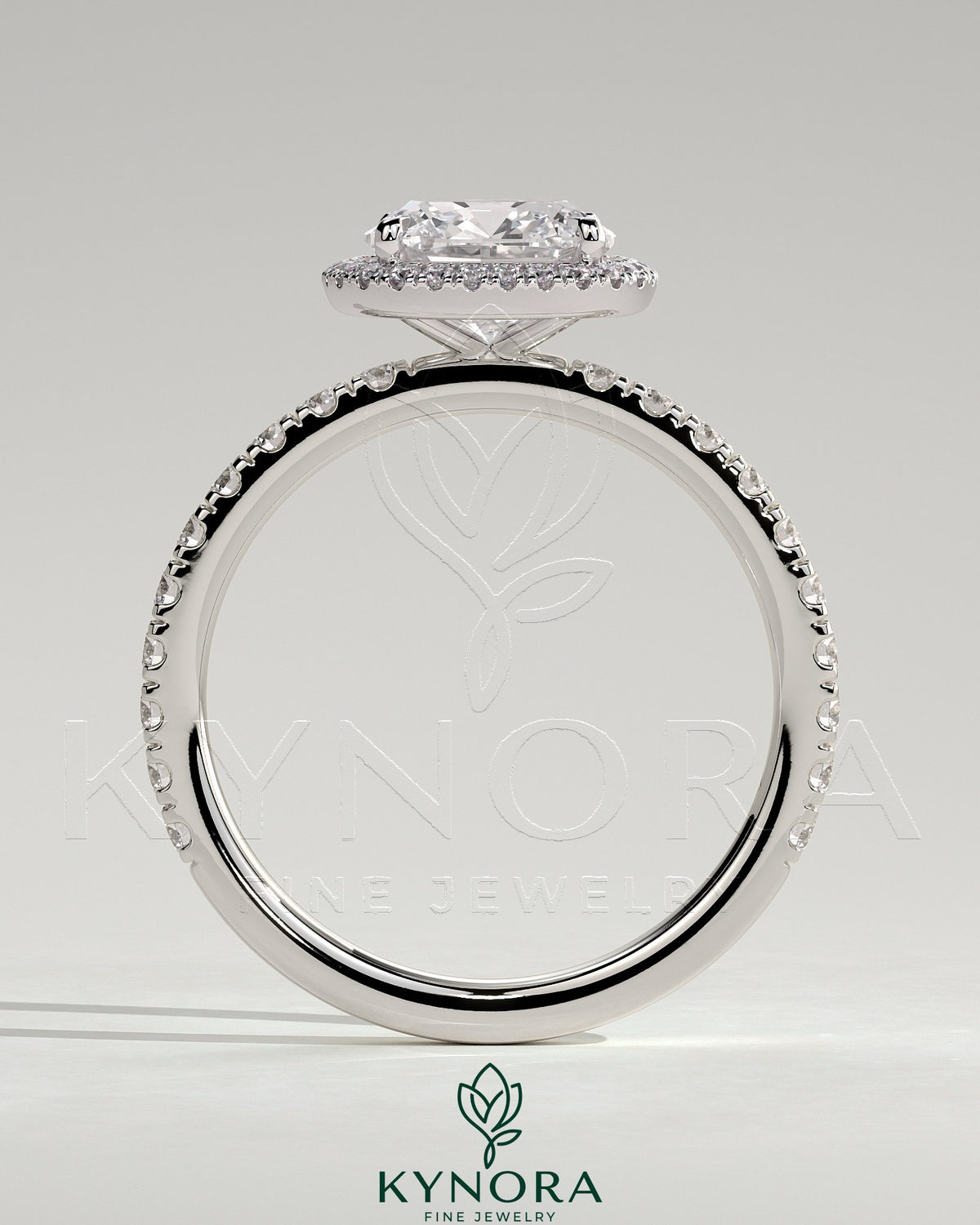 Kynora CJ 2ct cushion cut claw solitaire engagement ring with halo and pave band, showcasing sparkling diamond details.