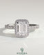 Kynora CJ 2ct emerald cut solitaire halo engagement ring with pave band, showcasing a sparkling emerald gemstone and intricate design.