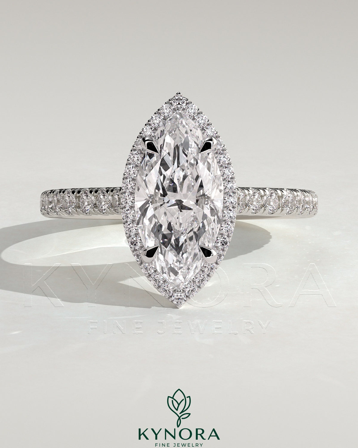 Kynora CJ 2ct marquise claw solitaire engagement ring with halo, pave band, and cathedral high setting, showcasing elegant diamond design. Imagen principal del producto