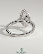 Kynora CJ 2ct marquise claw solitaire engagement ring with halo, pave band, and cathedral high setting.