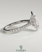 Kynora CJ 2ct marquise claw solitaire engagement ring with halo, pave band, and cathedral high setting showcasing sparkling diamonds.
