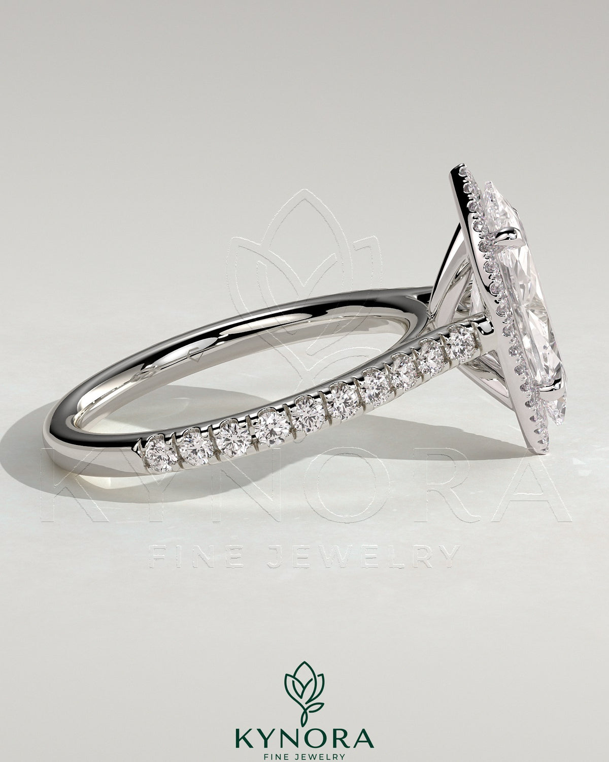 Kynora CJ 2ct marquise claw solitaire engagement ring with halo, pave band, and cathedral high setting showcasing sparkling diamonds.