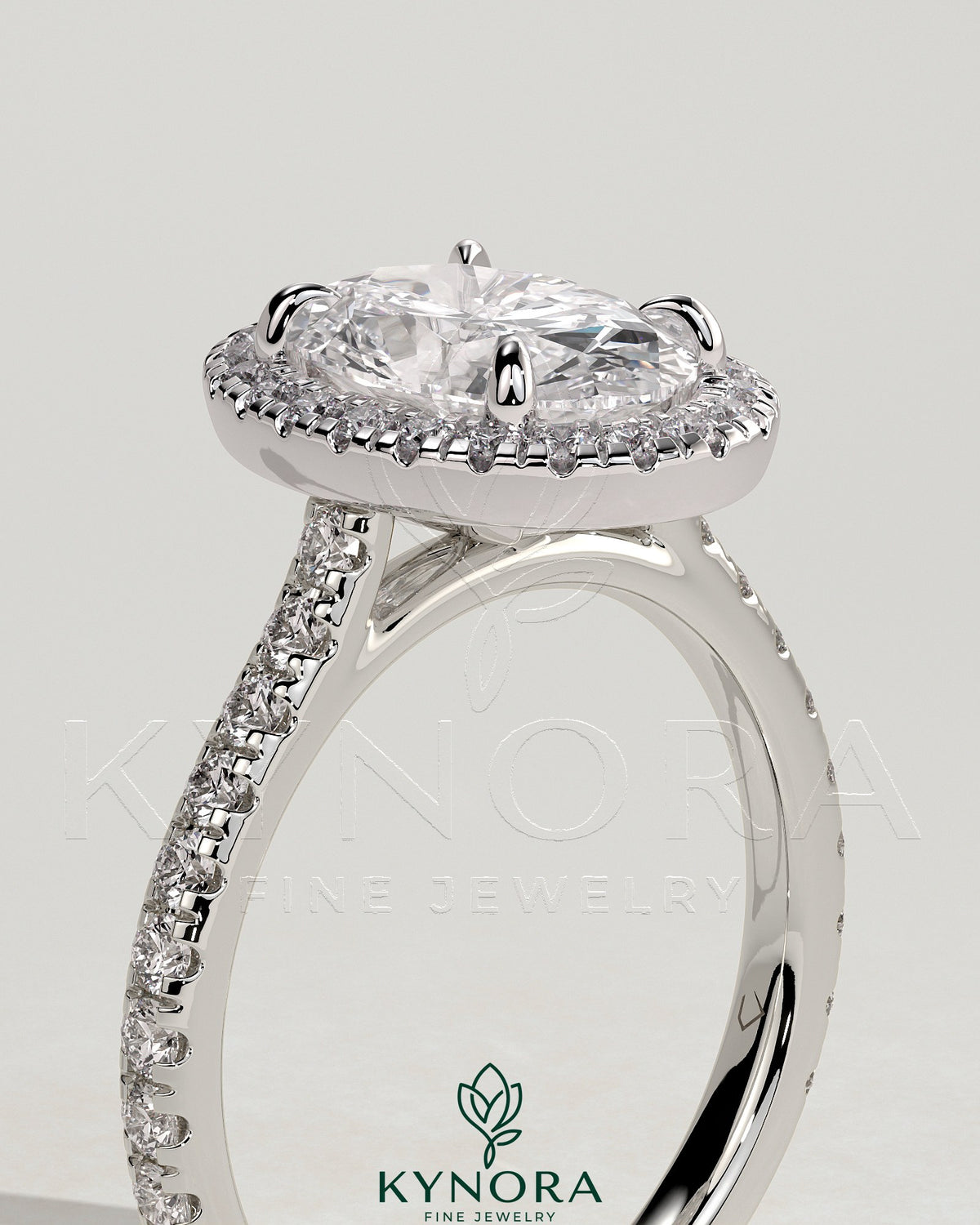 Kynora CJ 2ct oval claw solitaire engagement ring with halo, pave band, and cathedral high setting showcasing sparkling diamond details