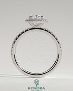 Kynora CJ 2ct oval claw solitaire engagement ring with halo and pave band showcasing a sparkling center stone and detailed band design