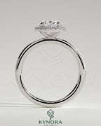 Kynora CJ 2ct oval claw solitaire engagement ring with halo of small diamonds, elegant and sparkling jewelry piece.
