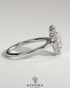 Kynora CJ 2ct oval claw solitaire engagement ring with sunburst halo and cathedral high setting, showcasing elegant jewelry design.