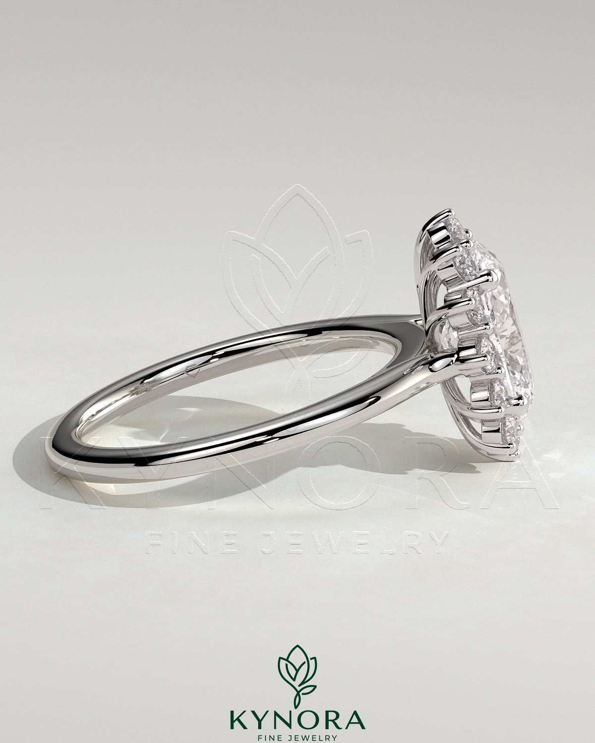 Kynora CJ 2ct oval claw solitaire engagement ring with sunburst halo and cathedral high setting, showcasing elegant jewelry design.