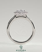 Kynora CJ 2ct oval claw solitaire engagement ring with sunburst halo and cathedral high setting, showcasing intricate design details.