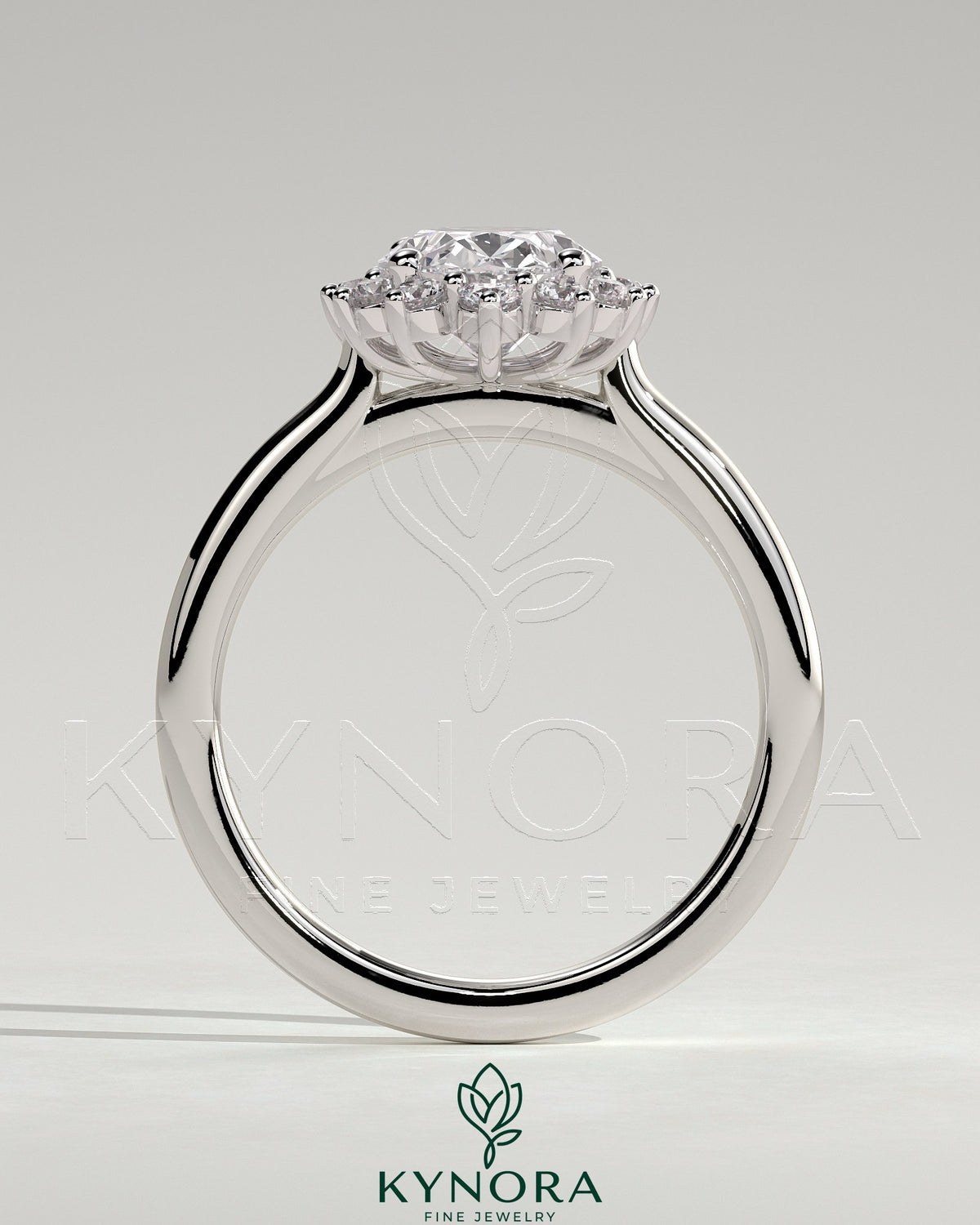 Kynora CJ 2ct oval claw solitaire engagement ring with sunburst halo and cathedral high setting, showcasing intricate design details.
