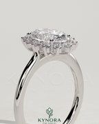 Kynora CJ 2ct oval claw solitaire engagement ring with sunburst halo and cathedral high setting, showcasing intricate design details.