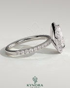 Kynora CJ 2ct pear-shaped diamond halo engagement ring with pave band and intricate setting, showcasing elegant jewelry craftsmanship.