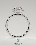 Kynora CJ 2ct pear-shaped diamond solitaire engagement ring with halo and pave band in elegant jewelry design.
