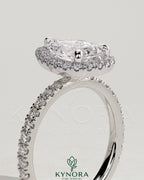 Kynora CJ 2ct pear-shaped diamond halo engagement ring with pave band, featuring a classic and elegant design.