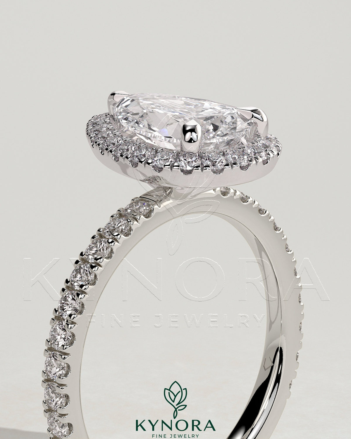 Kynora CJ 2ct pear-shaped diamond halo engagement ring with pave band, featuring a classic and elegant design.