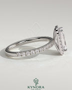 Kynora CJ 2ct radiant claw solitaire engagement ring with halo and pavé band, showcasing sparkling diamond details.