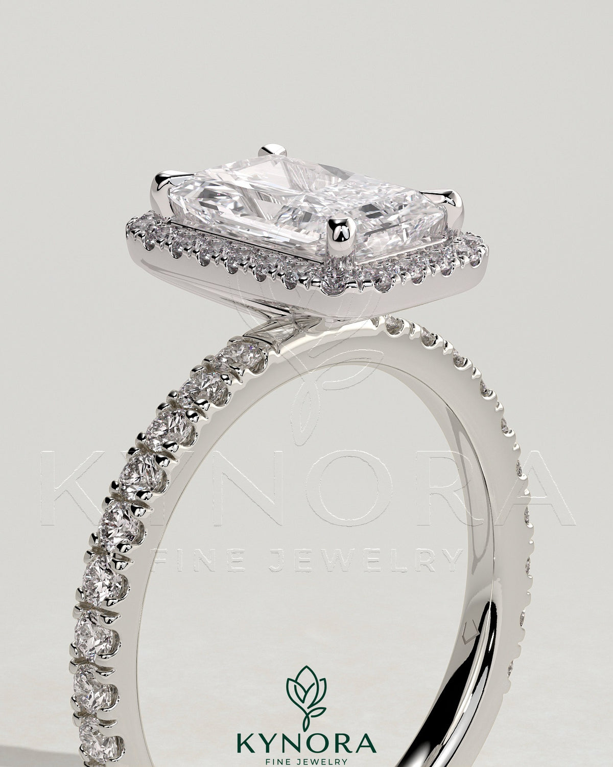 Kynora CJ 2ct radiant cut diamond claw solitaire engagement ring with halo and pave band, sparkling and elegant jewelry piece.