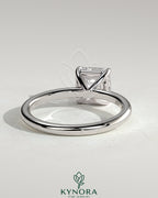 Kynora CJ 2-carat Asscher cut diamond solitaire engagement ring with claw setting, showcasing elegant craftsmanship and sparkling gem.