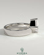 Kynora CJ 2ct Asscher cut diamond solitaire engagement ring with offset setting and flat cigar band in yellow gold.