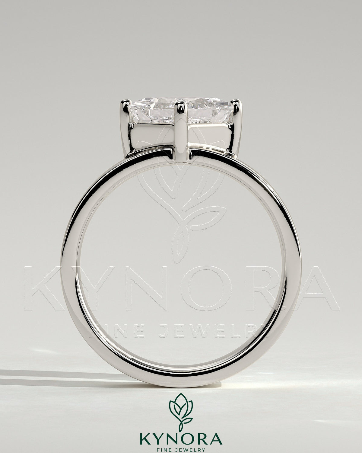 Kynora CJ 2ct Asscher cut solitaire engagement ring with claw setting, offset design, and flat cigar band in sterling silver.