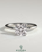 Kynora CJ 2ct cushion cut solitaire engagement ring with a sleek band, showcasing a sparkling central diamond.