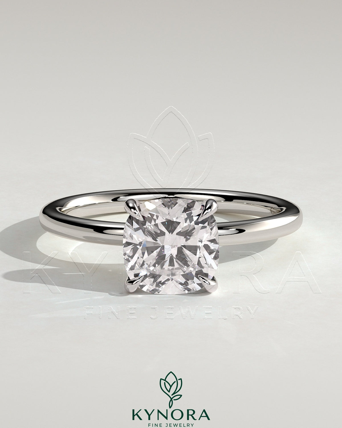 Kynora CJ 2ct cushion cut solitaire engagement ring with a sleek band, showcasing a sparkling central diamond.