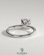 Kynora CJ 2ct cushion cut diamond solitaire engagement ring with claw setting, elegant and classic jewelry piece.