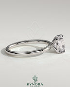 Kynora CJ 2ct cushion cut diamond solitaire engagement ring featuring a classic claw setting on a sleek band
