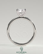 Kynora CJ 2-carat cushion cut solitaire engagement ring with a sleek band and sparkling diamond centerpiece.