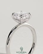 Kynora CJ 2-carat cushion claw solitaire engagement ring with a sparkling diamond set in a sleek platinum band.