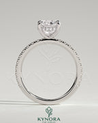 Kynora CJ 2ct cushion cut solitaire engagement ring with hidden halo and pave band in silver setting.