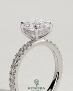 Kynora CJ 2ct cushion cut diamond solitaire engagement ring with hidden halo and pavé band, elegant and sparkling jewelry design.