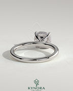 Kynora CJ 2ct cushion claw solitaire engagement ring with hidden halo, featuring a sparkling center stone and elegant design.