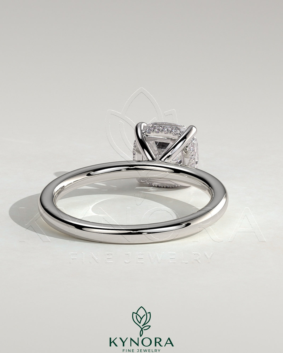 Kynora CJ 2ct cushion claw solitaire engagement ring with hidden halo, featuring a sparkling center stone and elegant design.